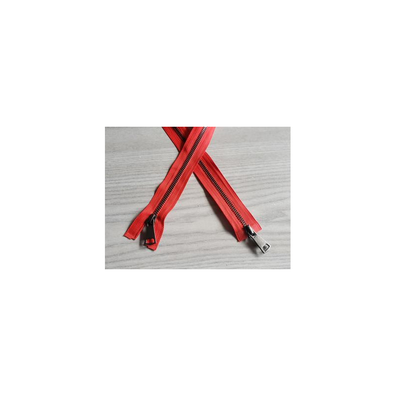 double slider metal zip - light red - metal gun 70cm long, placed on the table