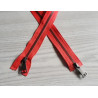 double slider metal zip - light red - metal gun 70cm long, placed on the table