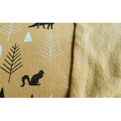 Sweatshirt jersey fabric -  FOREST on mustard background close up of the fabric , front and back