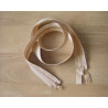 double slider chunky zip - beige 
 color, 110cm long, twisted on the wooden background