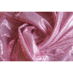flexible sequin fabric- blush pink color, the fabric twisted into a swirl