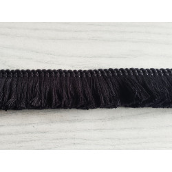 Short cotton fringe 3cm - black, placed on the table- close up on fringing