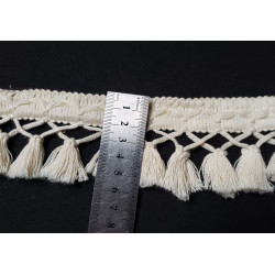 Cotton tassels- fringe - natural color, on a black background, with the ruler