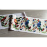 Outdoor fabric bunting panel - Vintage Parrots - placed on the table with fold