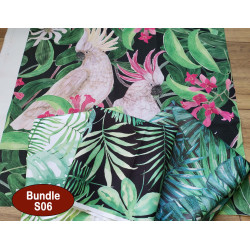 Outdoor fabric remnants bundle, 4 pieces of fabric, printed in jungle design placed on the table