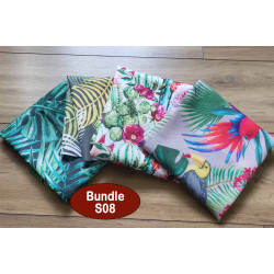 Outdoor fabric remnants bundle, 4 pieces of fabric, printed in parrots design placed on the table