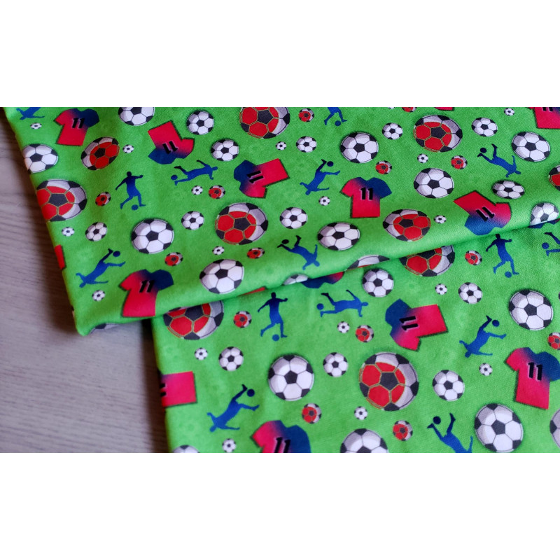 Soccer - green - single jersey , the fabric with the fold placed across the table