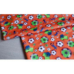Soccer - orange - single jersey , the fabric with the fold placed across the table