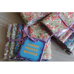 Floral fabric pre cuts bundle - 5 pieces, placed on the grey table