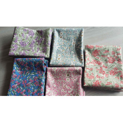 Floral fabric pre cuts bundle - 5 pieces, placed on the grey table