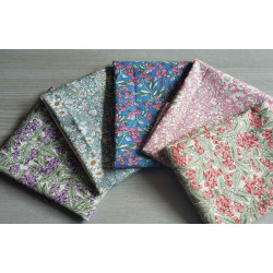 Floral fabric pre cuts bundle - 5 pieces, placed on the grey table, showing all designs of fabric