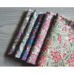 Floral fabric pre cuts bundle - 5 pieces, placed on the grey table, showing all designs of fabric