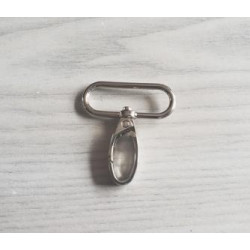 Swivel hook - metal - silver 38mm placed on a grey table