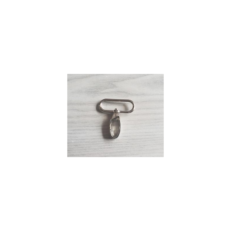 Swivel hook - metal - silver 38mm placed on a grey table