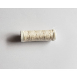 Sewing machine thread - pale beige color - 200m spool, placed on a white background