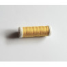 Sewing machine thread - dark yellow color - 200m spool, placed on a white background