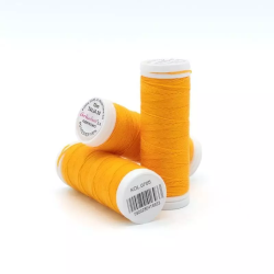 Sewing machine thread - orange color - 200m spool, placed on a white background