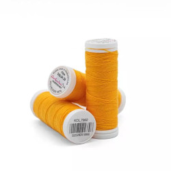 Sewing machine thread - orange color - 200m spool, placed on a white background