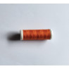 Sewing machine thread - deep tangerine color - 200m spool, placed on a white background