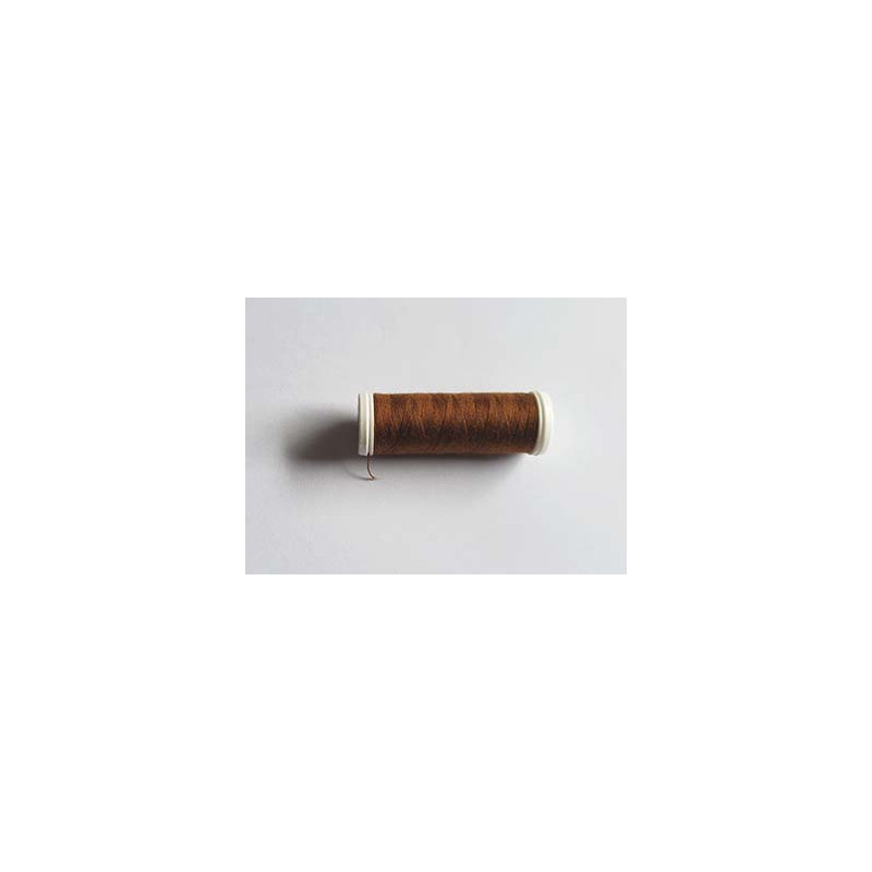 Sewing machine thread -deep bronze color - 200m spool, placed on a white background