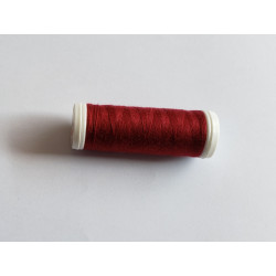 Sewing machine thread -darker burgundy color - 200m spool, placed on a white background