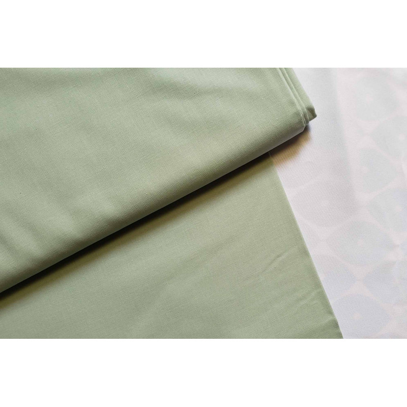 medium-weight cotton fabric -  light sage color, the fabric with the fold, placed across the frame