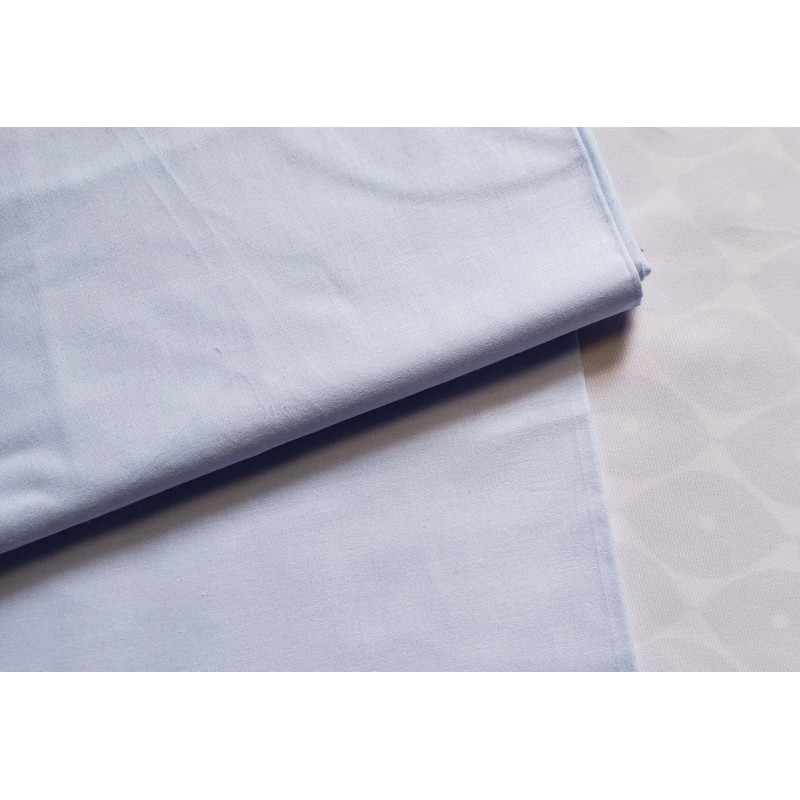 medium-weight cotton fabric -  light blue color, the fabric with the fold, placed across the frame