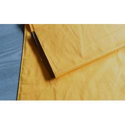 medium-weight cotton fabric -  mustard color, the fabric with the fold, placed across the frame