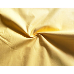 medium-weight cotton fabric -  mustard color, the fabric with the twist, placed across the frame