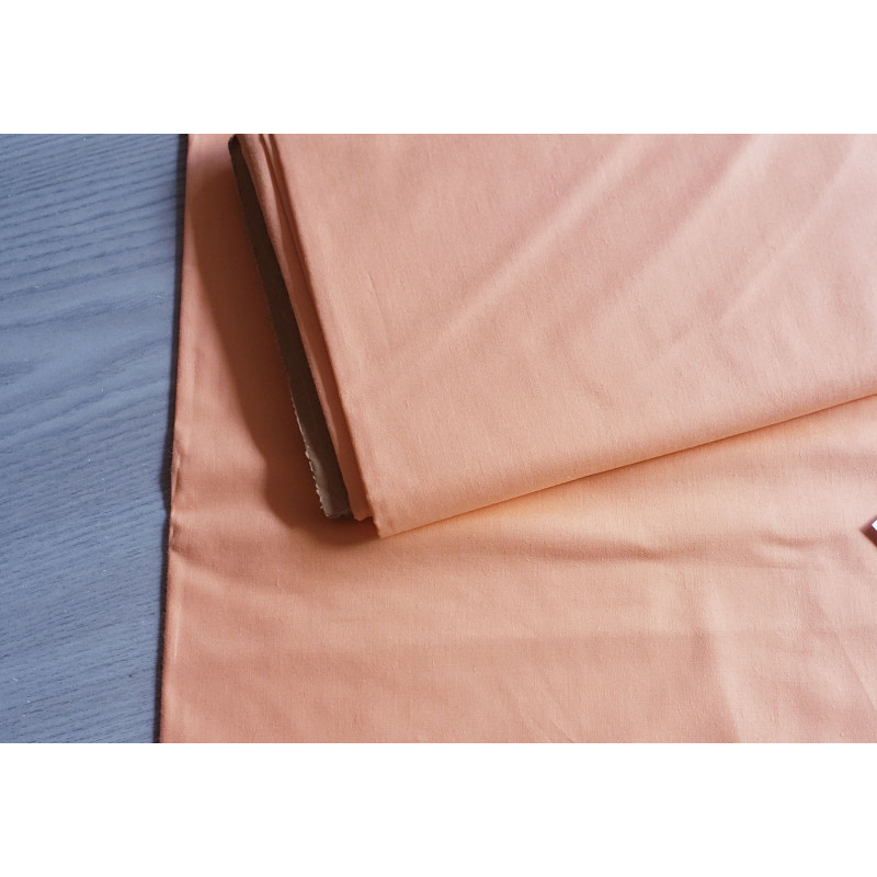 medium-weight cotton fabric -  salmon color, the fabric with the fold, placed across the frame