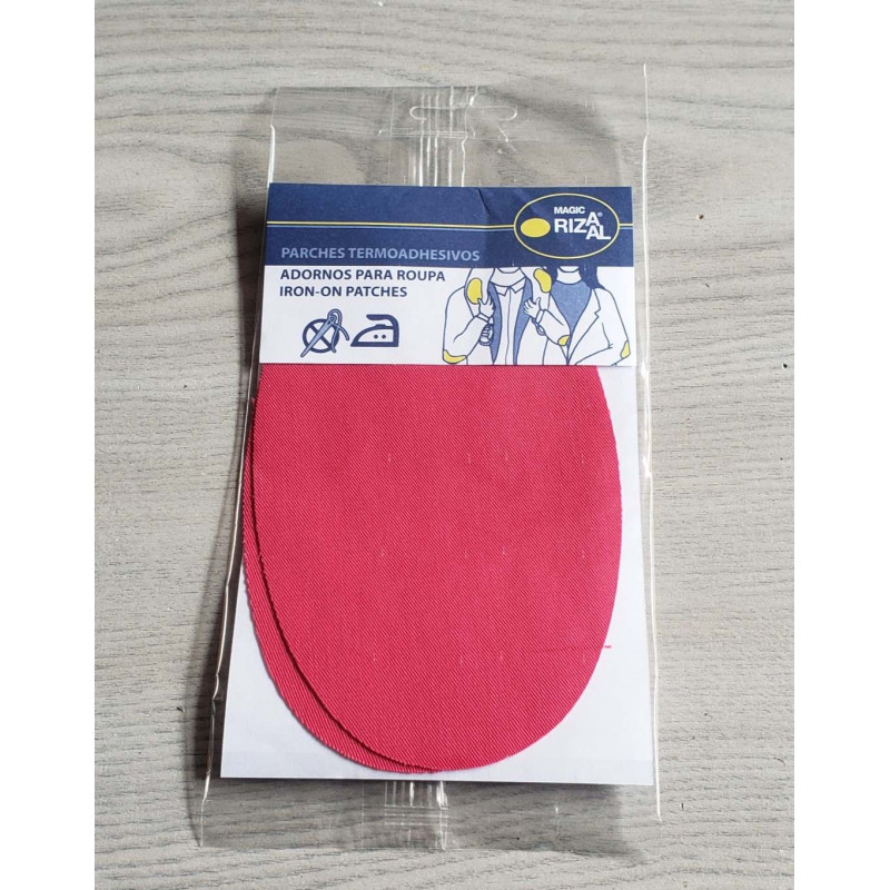 Iron-on cotton elbow patches - fuchsia on a grey table