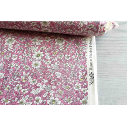 Ditsy floral cotton poplin - pink, fabric with the measuring tape, showing the edge of the fabric