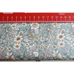 Ditsy floral cotton poplin - light teal, fabric with the measuring tape, to show the size of the pattern