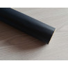 Self-Adhesive Faux leather fabric - navy, the roll of the fabric placed across the grey table