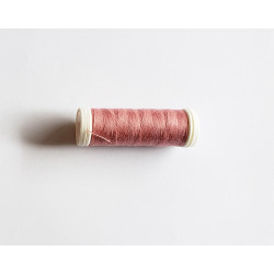 Sewing machine thread -  dark blush pink color - 200m spool, placed on a white background