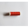 Sewing machine thread -  dark orange red color - 200m spool, placed on a white background