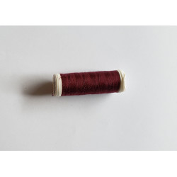 Sewing machine thread -  dark burgundy color - 200m spool, placed on a white background