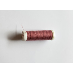 Sewing machine thread -  lighter rosewood color - 200m spool, placed on a white background