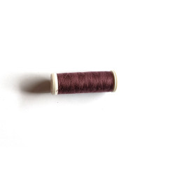 Sewing machine thread -  brown color - 200m spool, placed on a white background