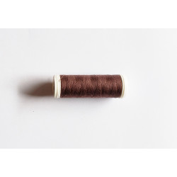 Sewing machine thread -  lighter brown color - 200m spool, placed on a white background