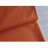 Oxford - Water-resistant canvas fabric - pumpkin color, the fabric placed across the frame with the fold