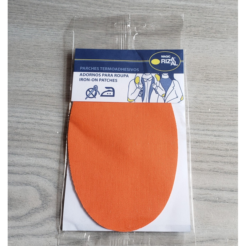 Iron-on cotton elbow patches - orange on a grey table