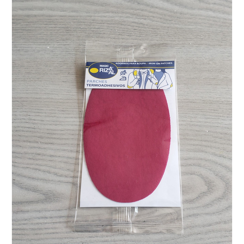 Iron-on cotton elbow patches - raspberry on a grey table