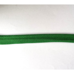 Plain, apple green flanged piping cord on white background