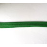 Plain, apple green flanged piping cord on white background