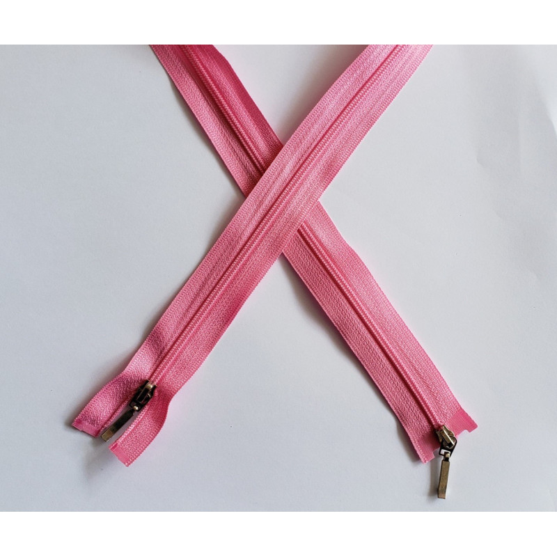 coil plastic double slider zip size 3 pink  - 80cm, crossed on the white background