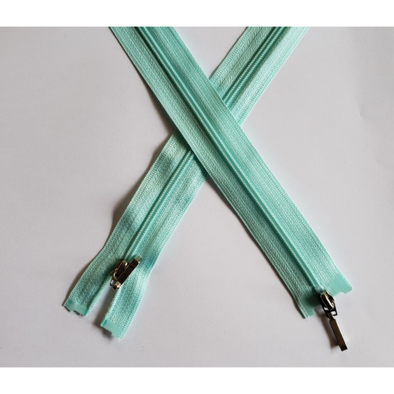 coil plastic double slider zip size 3 mint - 80cm, crossed on the white background