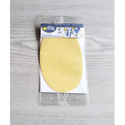 Iron-on cotton elbow patches - custard color on a grey table