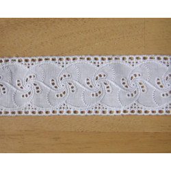 broderie anglaise trim - off white - 4cm wide, placed on a wooden background