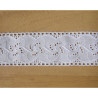 broderie anglaise trim - off white - 4cm wide, placed on a wooden background
